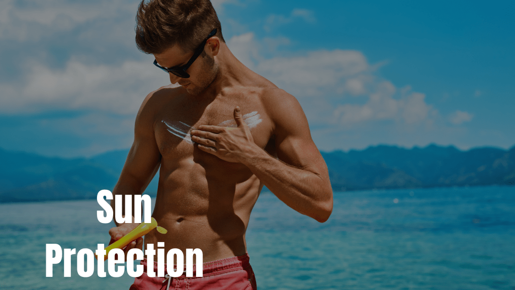 "Fit man applying sunscreen on his chest on a sunny beach, representing sun protection measures in men's skincare recommended by Epicorium."